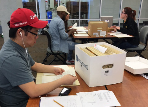 students work with archives in a class session in Special Collections