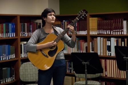Student performing at Performing Arts Library Open Mic Lunch event.