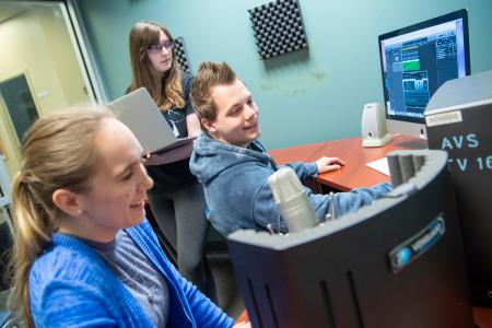 students work on a group project in one of the editing suites in the Student Multimedia Studio