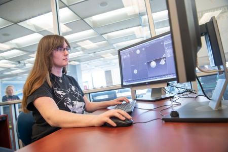 A student uses the 3D Modeling & Animation computer to work on a proejct