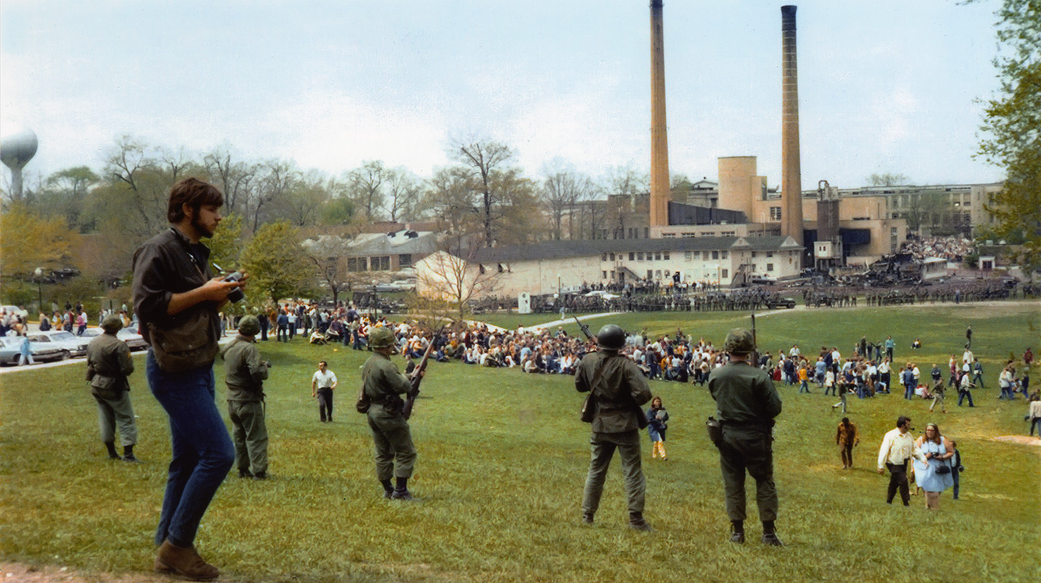 John Filo (left) with camera in hand, overlooking the National Guardsmen and students on May 4, 1970.