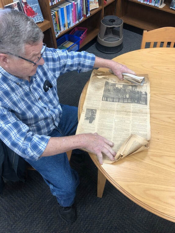 Man reading newspaper